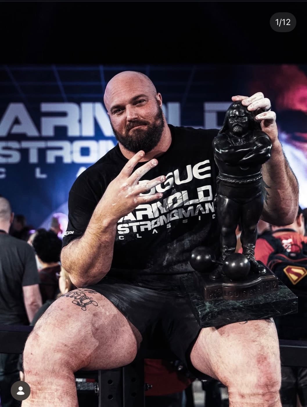 Mitchell Hooper holding the Arnold Strongman Classic trophy